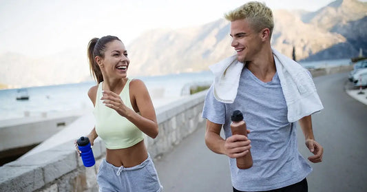 a couple of friends re-hydrating after a workout